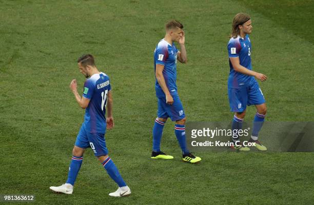 Gylfi Sigurdsson, Alfred Finnbogason and Birkir Bjarnason of Iceland walk off dejected following their sides defeat in the 2018 FIFA World Cup Russia...