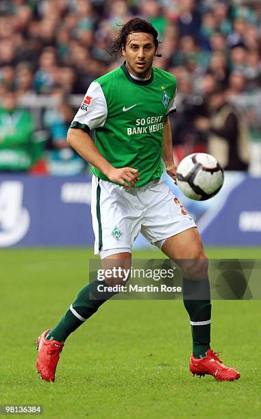 Claudio Pizarro of Bremen runs with the ball during the Bundesliga match between Werder Bremen and 1. FC Nuernberg at the Weser Stadium on March 27,...