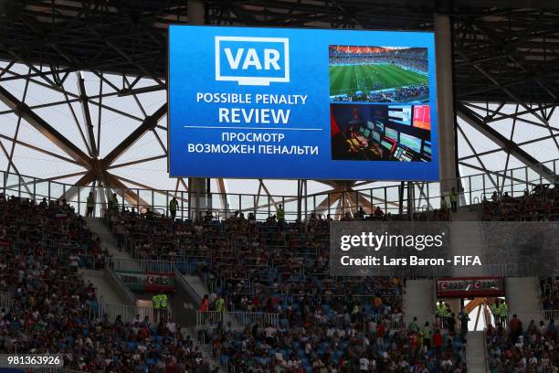 The big screen inside the stadium shows that a VAR review is in place which resulted in Iceland being awarded a penalty during the 2018 FIFA World...