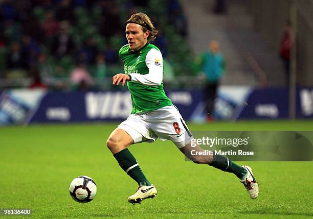 Clemens Fritz of Bremen runs with the ball during the Bundesliga match between Werder Bremen and 1. FC Nuernberg at the Weser Stadium on March 27,...