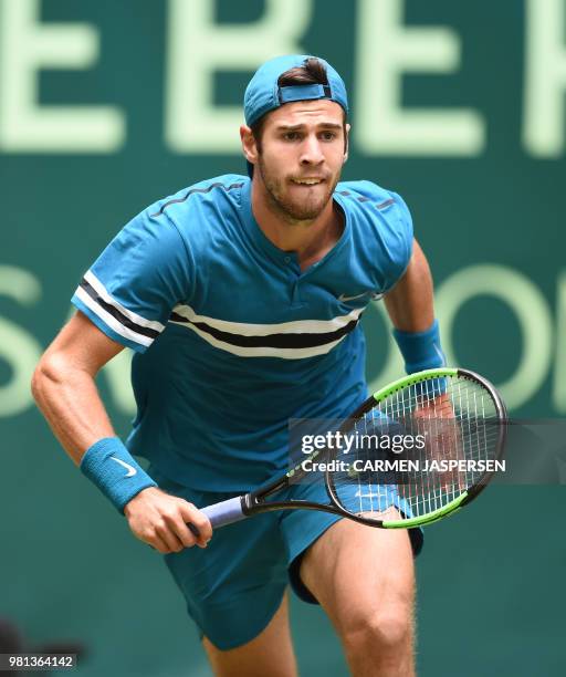 Karen Khachanov from Russia runs to catch the ball during his match against Roberto Bautista Agut from Spain at the ATP Gerry Weber Open tennis...