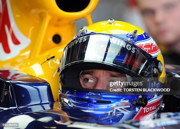 Red Bull Racing's Mark Webber of Australia looks over his shoulder during the first practice session of Formula One's Australian Grand Prix in...