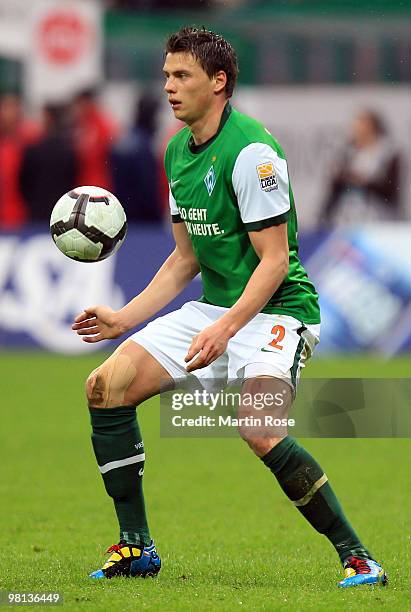 Sebastian Boenisch of Bremen runs with the ball during the Bundesliga match between Werder Bremen and 1. FC Nuernberg at the Weser Stadium on March...