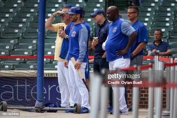 Manager Joe Maddon of the Chicago Cubs and general manager Theo Epstein look on as Yu Darvish of the Chicago Cubs throws a simulated game before the...