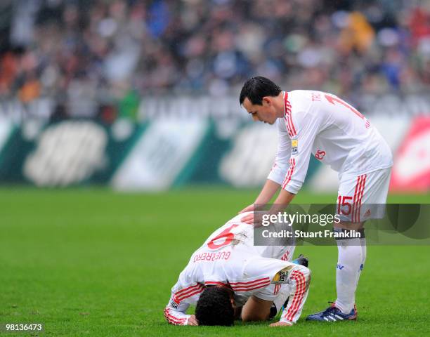 Paolo Guerrero and Piotr Trochowski of Hamburg look dejected during the Bundesliga match between Borussia Moenchengladbach and Hamburger SV at...