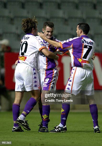 Alastair Edwards of Perth is congratulated by team-mates Bobby Despotovski and Scott Miller after scoring the first goal in the match between...