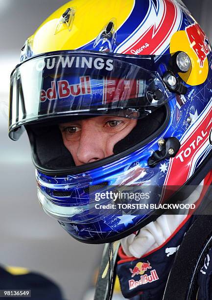 Red Bull Racing's Mark Webber of Australia looks on during the first practice session of Formula One's Australian Grand Prix in Melbourne on March...