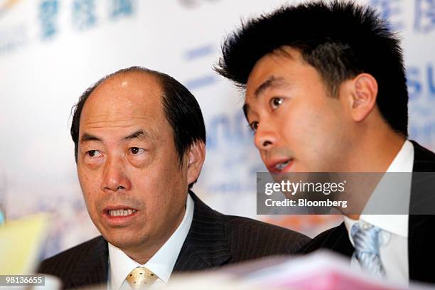 Yeung Kwok Keung, chairman of Country Garden Holdings Co., left, speaks with Johnson Murr, Head of Investor relations, at a news conference...