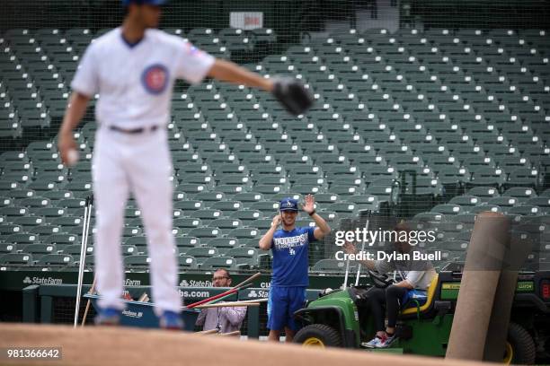 Kenta Maeda of the Los Angeles Dodgers waves as Yu Darvish of the Chicago Cubs throws a simulated game at Wrigley Field on June 20, 2018 in Chicago,...