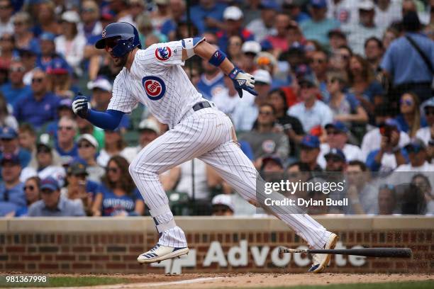 Kris Bryant of the Chicago Cubs hits a single in the fifth inning against the Los Angeles Dodgers at Wrigley Field on June 20, 2018 in Chicago,...