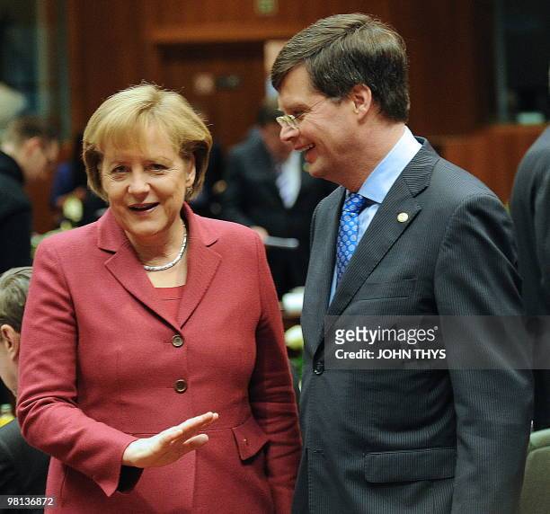 German Chancellor Angela Merkel talks with Dutch Prime Minister Jan Peter Balkenende prior to a working session of an European Union summit at the...