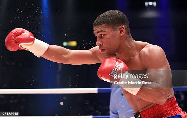 Yuriorkis Gamboa of Cuba in action against Jonathan Barros of Argentina during the featherweight WBA championship fight during the ran boxen knockout...