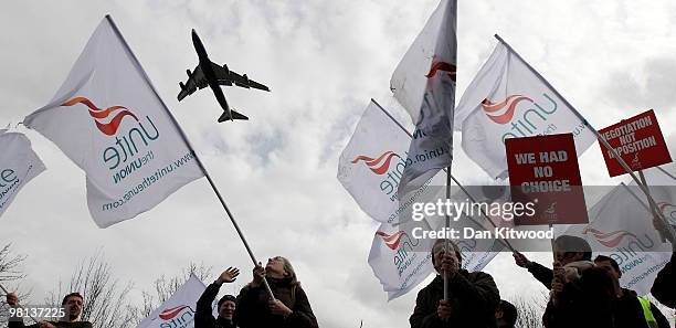 British Airways plane flies over cabin crew demonstrators near Heathrow airport on March 30, 2010 in London, England. Today is the last day of a four...