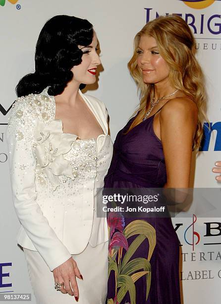 Actress Dita Von Teese and singer Fergie arrive to the "Clive Davis Pre-Grammy Party" at the Beverly Hilton Hotel on February 9, 2008 in Beverly...