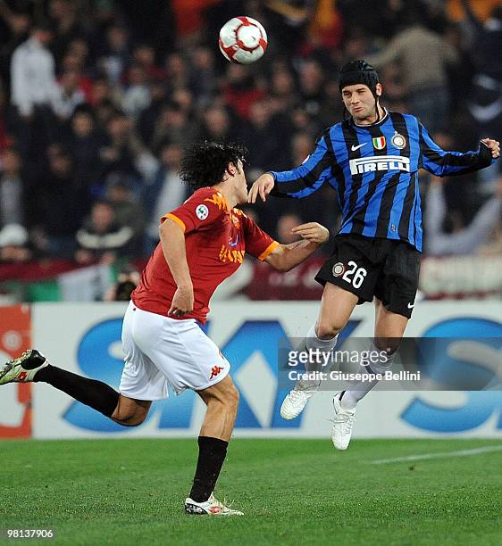 Luca Toni of Roma and Cristian Chivu of Inter in action during the Serie A match between AS Roma and FC Internazionale Milano at Stadio Olimpico on...