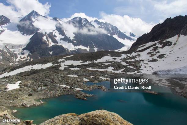 lake with mountains in background, aperer turm, stubaital, tyrol, austria - turm stock pictures, royalty-free photos & images