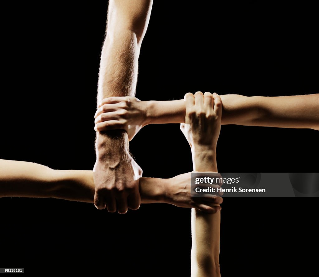 Hands gripping each other's wrists
