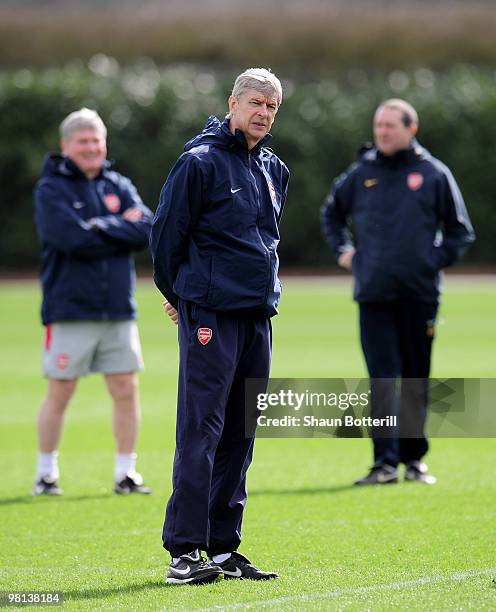 Arsene Wenger the Arsenal manager watches his players during Arsenal training ahead of their UEFA Champions League quarter final first leg match...