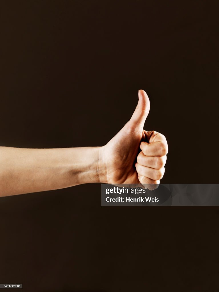 Hand indicating thumbs up