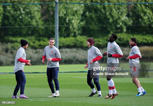 Carlos Vela, Thomas Vermaelen, Tomas Rosicky, Emmanuel Eboue and Denilson of Arsenal warm-up during Arsenal training ahead of their UEFA Champions...