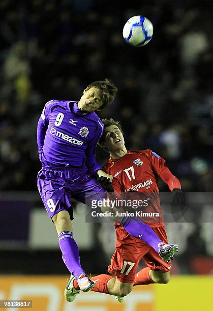 Tadanari Lee of Sanfrecce Hiroshima and Michael Marrone of Adelaide United compete for the ball during the AFC Champions League Group H match between...