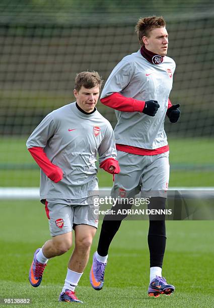 Arsenal's Russian midfielder Andrey Arshavin and Danish player Niklas Bendtner attend a training session at the club's complex in London Colney, on...