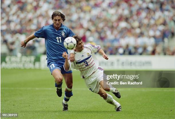 Dino Baggio of Italy challenges Bixente Lizarazu of France during the1998 FIFA World Cup Quarter Final on 3 July 1998 played at the Stade de France,...