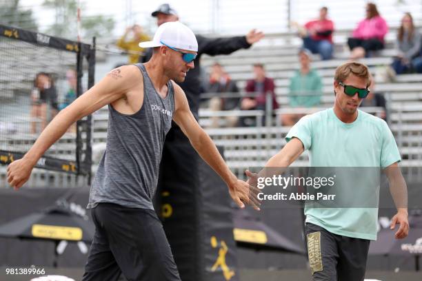 Jake Gibb and Taylor Crabb celebrate during their win against Eric Beranek and Michael Brunsting during opening rounds of the AVP Seattle Open at...