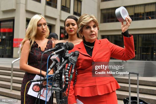 Former NFL Houston Texans cheerleaders Hannah Turnbow and Angelina Rosa watch Attorney Gloria Allred holds up a roll of duct tape as she hosts a...