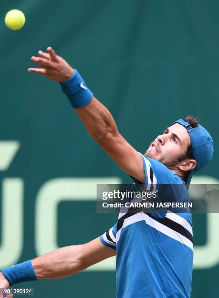 Karen Khachanov from Russia serves the ball to Roberto Bautista Agut from Spain during their match at the ATP Gerry Weber Open tennis tournament in...