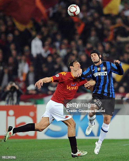 Luca Toni of Roma and Cristian Chivu of Inter in action during the Serie A match between AS Roma and FC Internazionale Milano at Stadio Olimpico on...