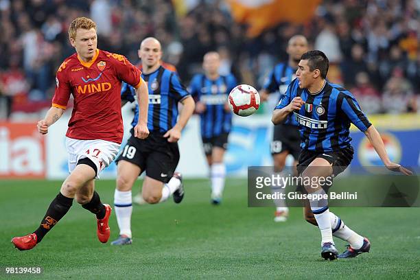 John Arne Riise of Roma and Lucio of Inter in action during the Serie A match between AS Roma and FC Internazionale Milano at Stadio Olimpico on...