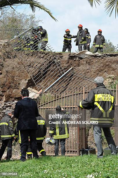 Firefighters work on a collapsed area of the Trajan gallery located at the ancient Domus Aurea site , built by Roman emperor Nerone, in front of the...