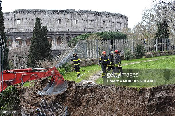 Firefighters work on a collapsed area of the Trajan gallery located at the ancient Domus Aurea site , built by Roman emperor Nerone, in front of the...