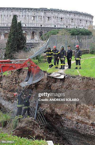 Firefighters work on a collapsed area of the Trajan gallery located at the ancient Domus Aurea site , built by Roman emperor Nerone, in front of the...