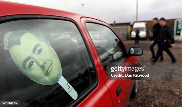 Cardboard cutout of British Airways boss Willie Walsh sits in a car window as demonstrators wait to embark a double decker bus near Heathrow airport...