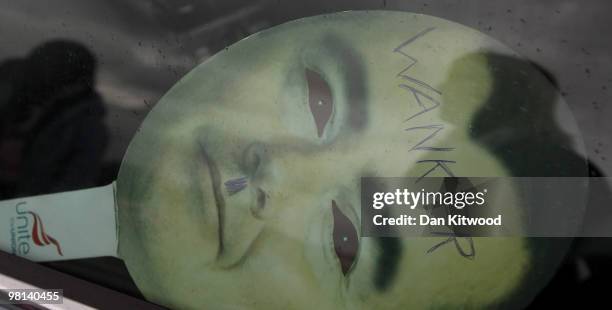 Cardboard cutout of British Airways boss Willie Walsh sits in a car window as demonstrators wait to embark a double decker bus near Heathrow airport...