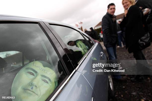 Cardboard cutout of British Airways boss Willie Walsh sits in a car window as demonstrators wait to embark a double decker bus near Heathrow airport...