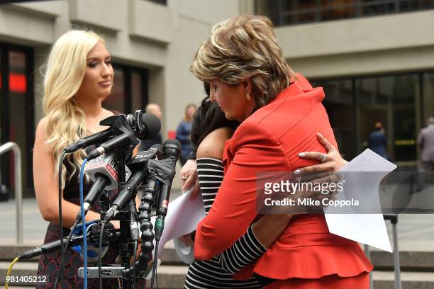 Former NFL Houston Texans cheerleaders Hannah Turnbow watches as Angelina Rosa and Attorney Gloria Allred embrace during a press conference outside...