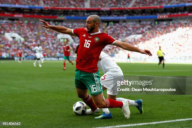 Nordin Amrabat of Morocco gets tackled by Raphael Guerreiro of Portugal during the 2018 FIFA World Cup Russia group B match between Portugal and...
