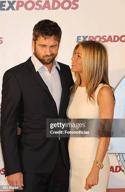 Actress Jennifer Aniston and actor Gerard Butler attend 'Exposados' photocall, at the Villamagna Hotel on March 30, 2010 in Madrid, Spain.