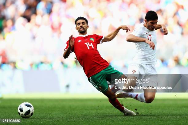 Mbark Boussoufa of Morocco gets past the tackle from Goncalo Guedes of Portugal during the 2018 FIFA World Cup Russia group B match between Portugal...