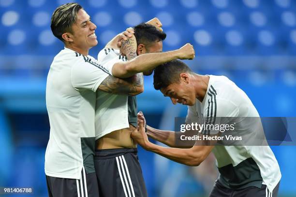 Carlos Salcedo, Marco Fabian and Hector Moreno of Mexico have fun during a training session ahead of the match against Korea as part of FIFA World...