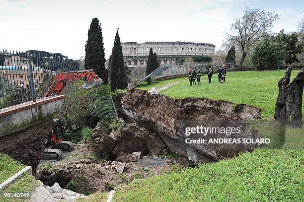 Firefighters work on a collapsed area of the Trajan gallery located at the ancient Domus Aurea site , built by Roman emperor Nerone, in front of the...