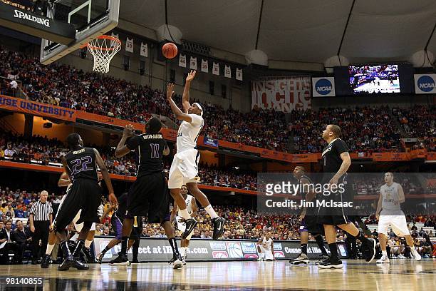 Kevin Jones of the West Virginia Mountaineers attempts a shot against the Washington Huskies during the east regional semifinal of the 2010 NCAA...
