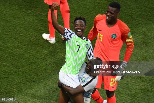 Nigeria's forward Ahmed Musa and Nigeria's goalkeeper Francis Uzoho celebrate with a team staff member at the end of the Russia 2018 World Cup Group...