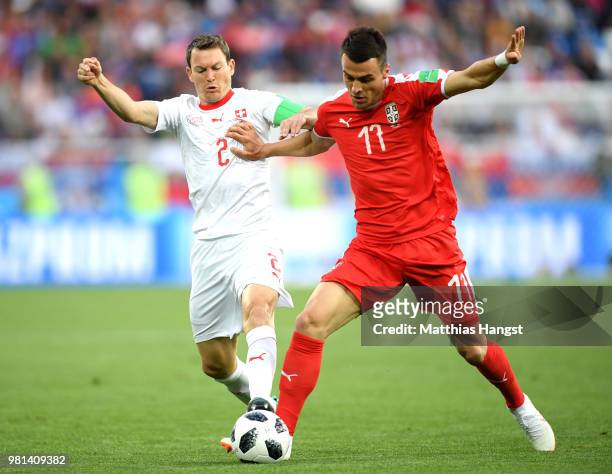 Stephan Lichtsteiner of Switzerland tackles Filip Kostic of Serbia during the 2018 FIFA World Cup Russia group E match between Serbia and Switzerland...