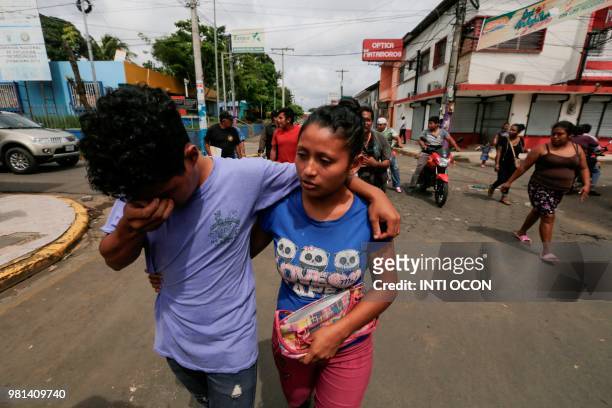 Man -who had been arrested in recent protests- embraces a relative as he walks after being released from jail in Masaya, Nicaragua on June 22, 2018....