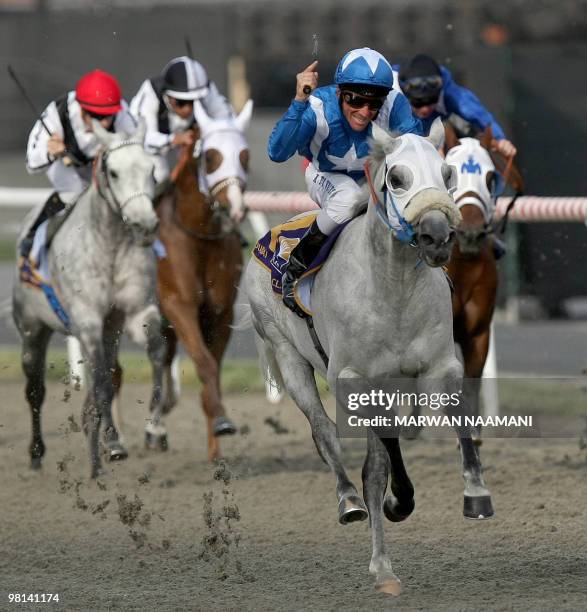 Jockey Adrie De Vries leads his horse Jaafar to win the Dubai Kahayla Classic, the first race of the Dubai World Cup, the world's richest horse race...