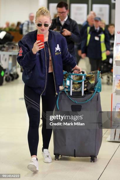 Sophie Turner arriving at Aberdeen Airport facetiming Joe Jonas before the wedding of Kit Harrington and Rose Leslie on June 22, 2018 in Aberdeen,...